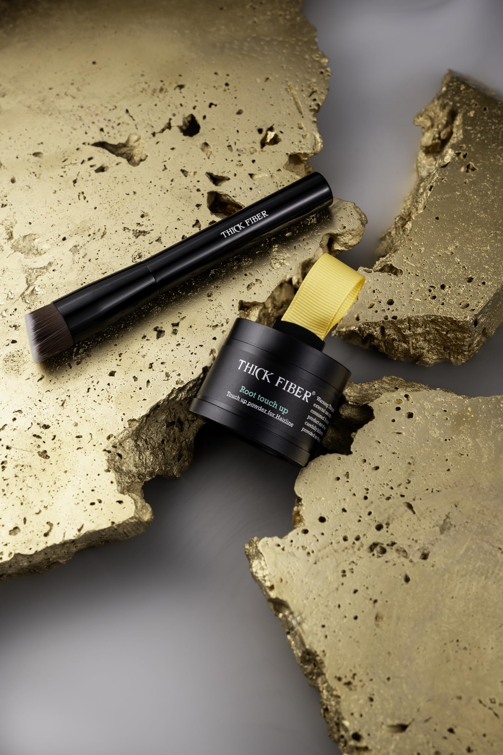 THICK FIBER water resistant formula lasts through rain or sweat