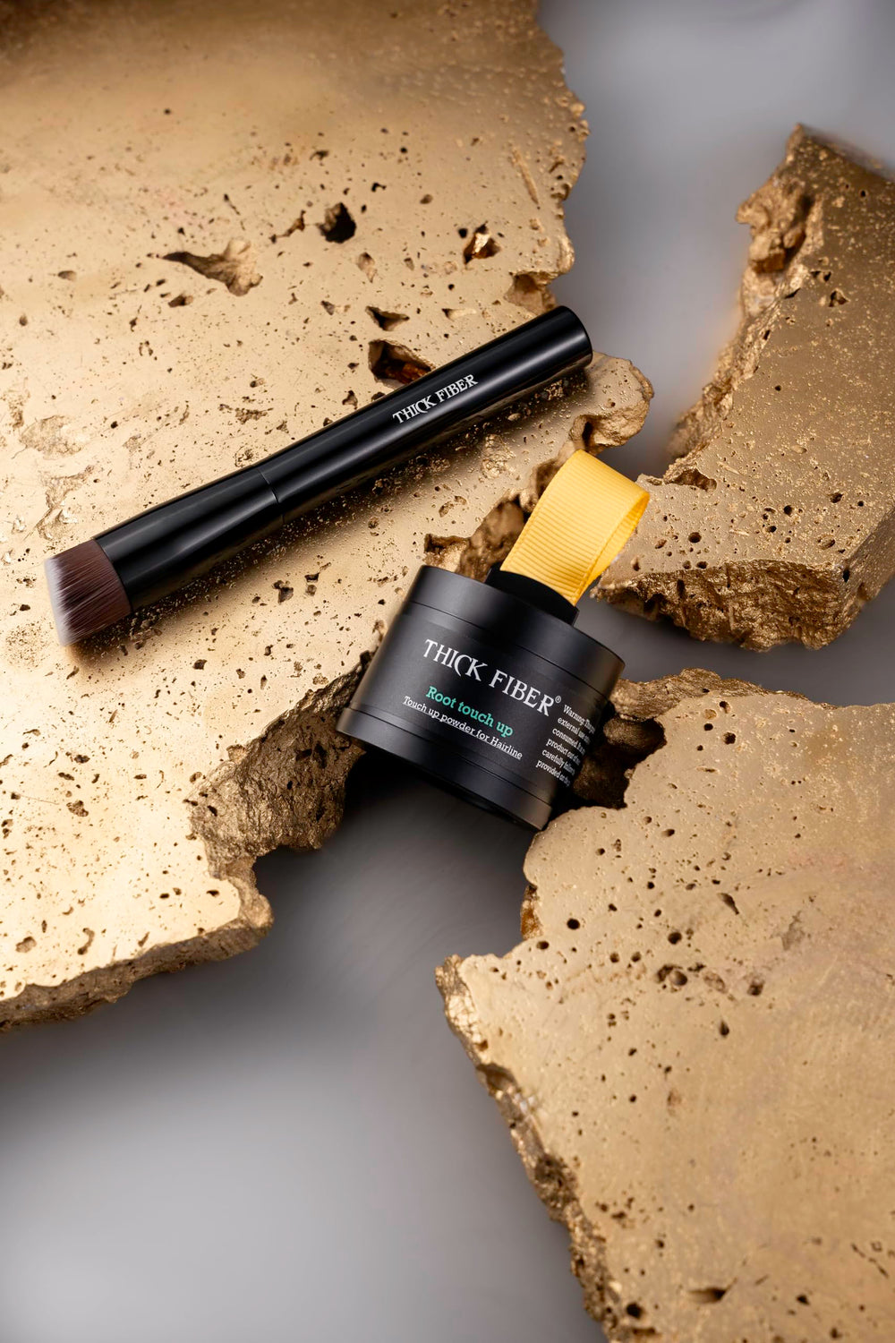 THICK FIBER water resistant formula lasts through rain or sweat