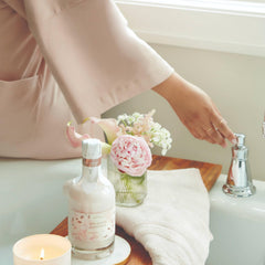 Close-up of Thymes Goldleaf Gardenia bubbles showing a silky bath texture.