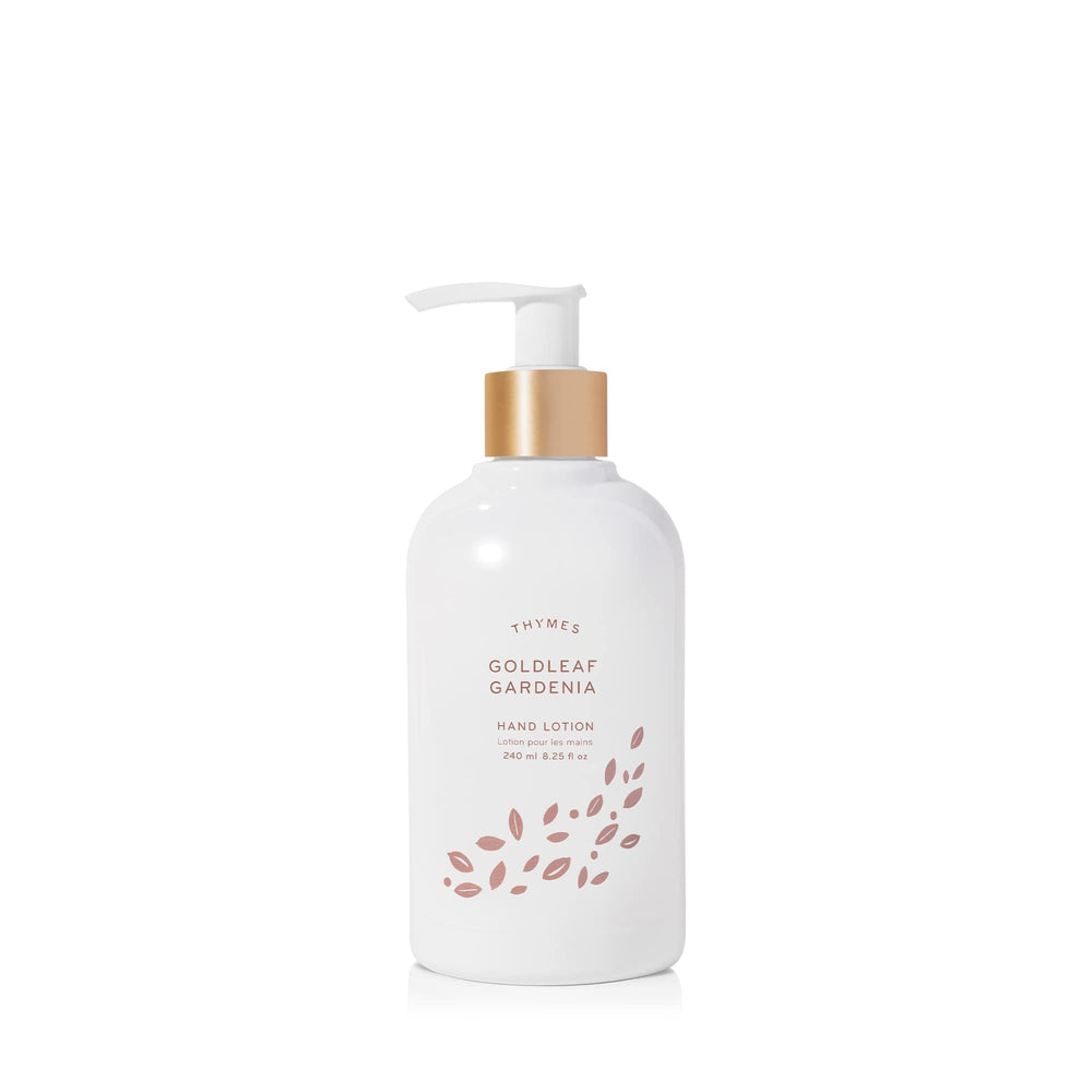 Thymes Hand Lotion Gold Pump bottle close-up, goldleaf detail signaling premium hydration for silky hands.