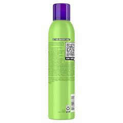 TIGI Bed Head Foxy Curls Mousse being dispensed from hands for easy application.