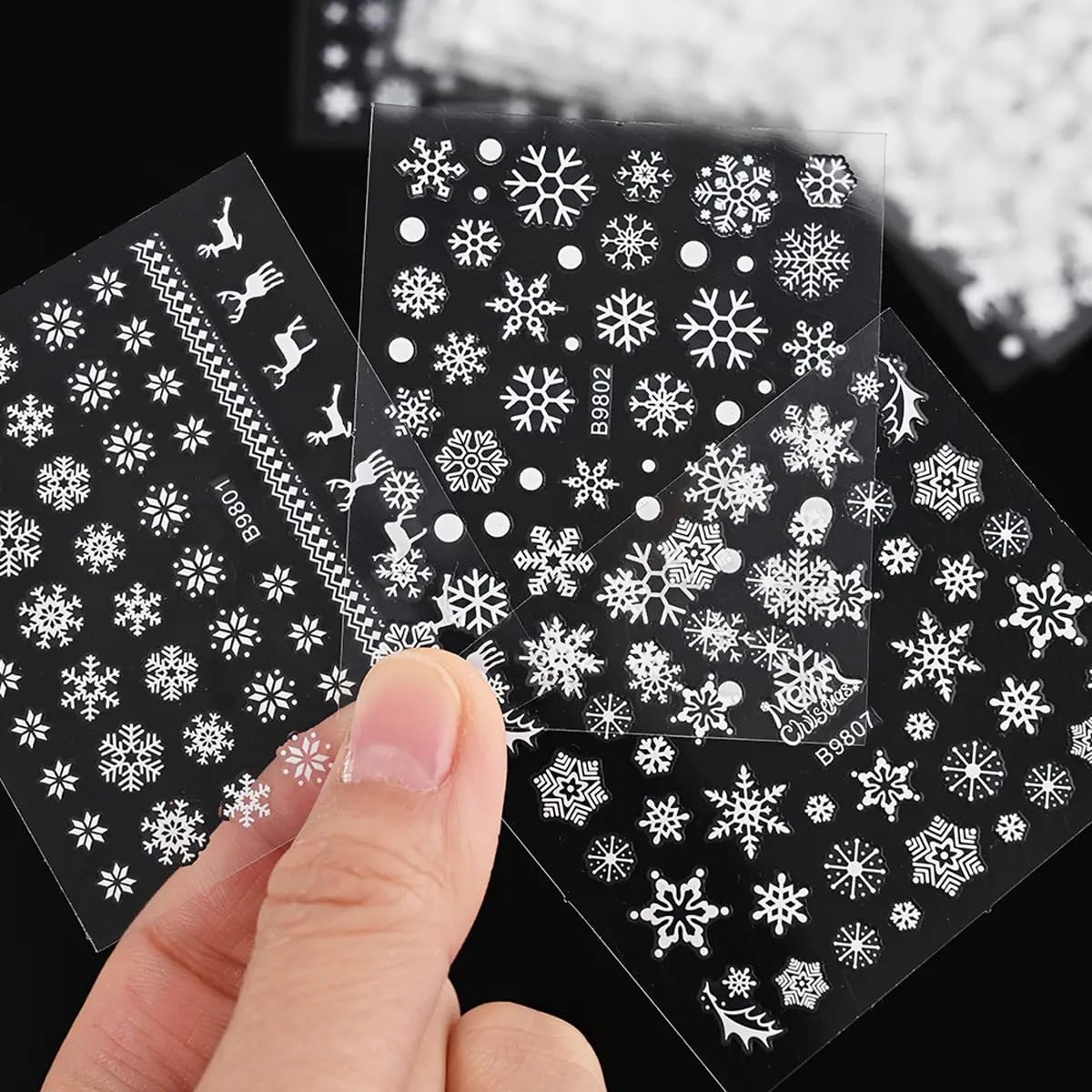 Tiwnefua nails with snowflake decals highlight elegant winter style on natural nails.