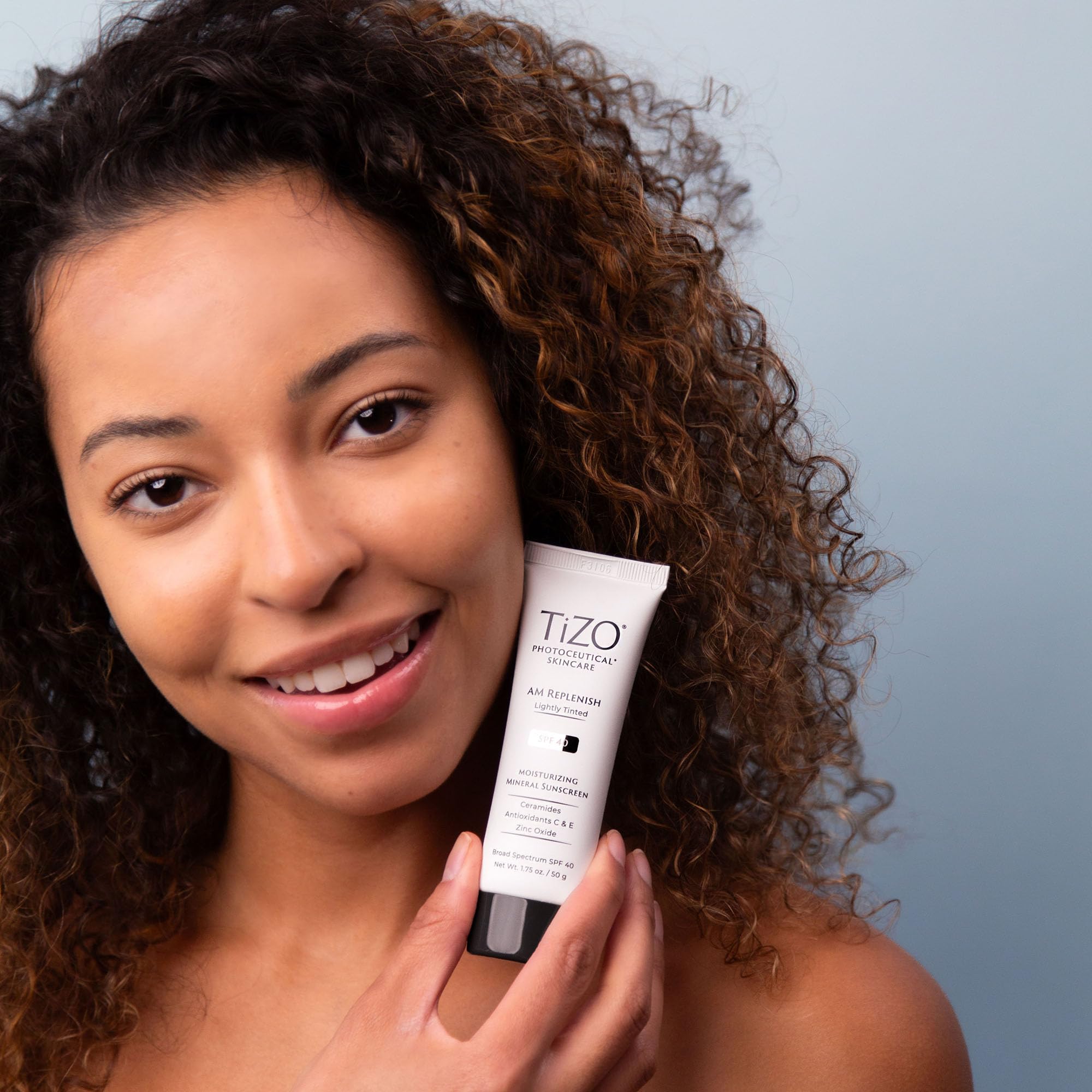 TIZO AM Replenish SPF 40 outer packaging highlights the Skin Cancer Foundation endorsement.