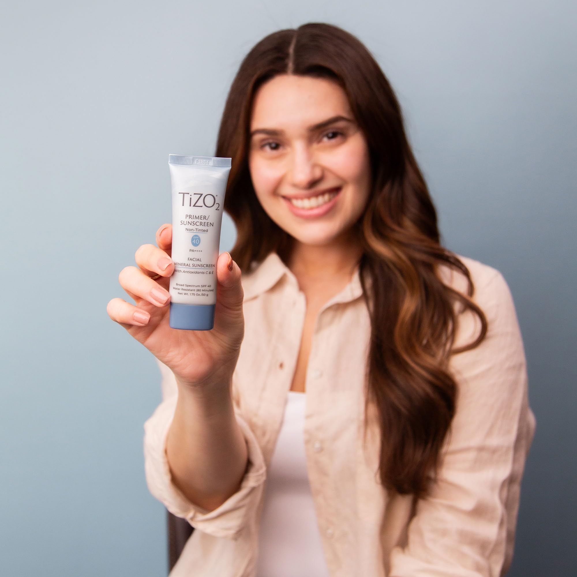 TIZO2 sunscreen primer usage shot showing smooth makeup-ready skin