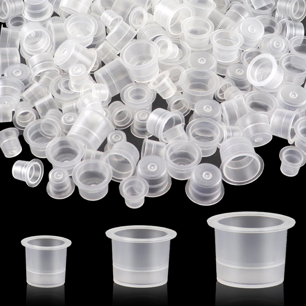 TKYZMS tattoo ink caps 300pcs in clear cups for organized color selection during sessions.