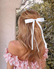 Tobeffect hair bows back-of-head styling close-up.