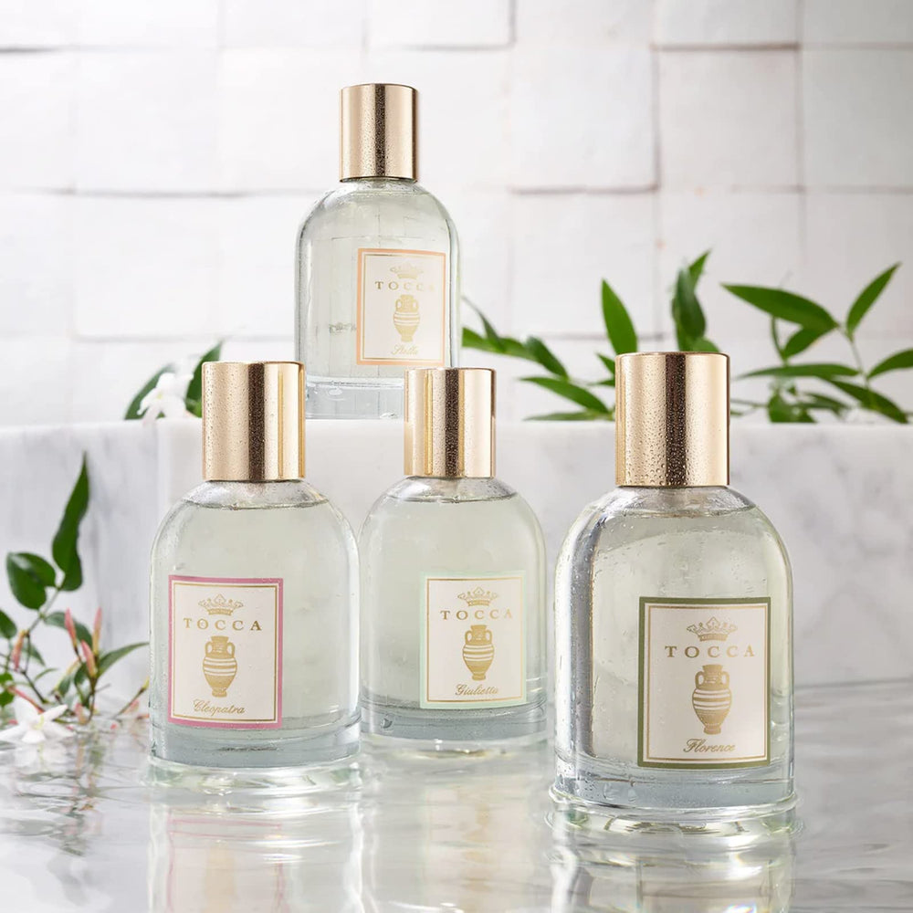 Tocca Florence body oil application on hands demonstrates easy absorption and smooth skin.