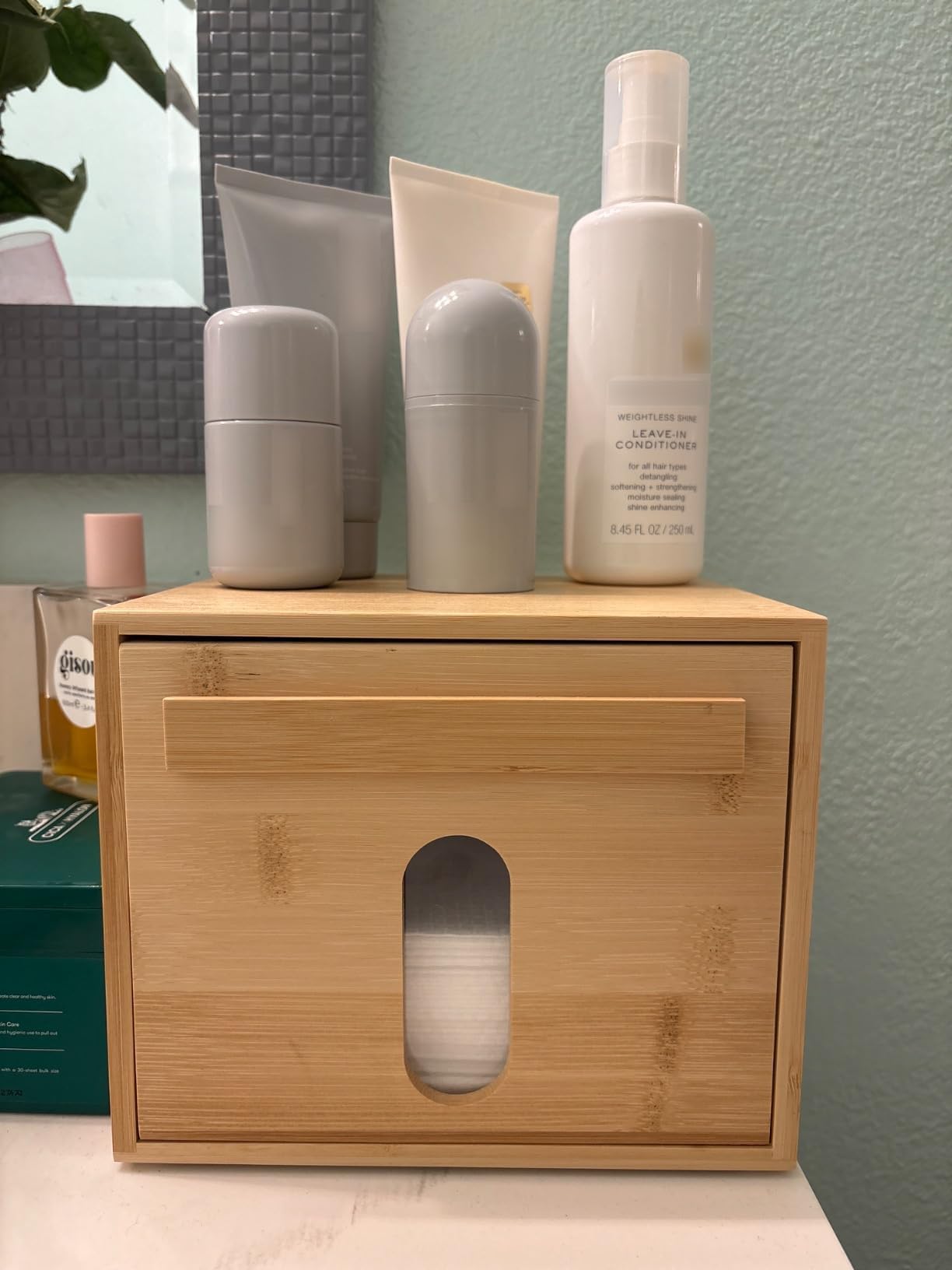 Tohiasen box-assembled-on-bathroom-vanity depicts a compact towel organization setup.