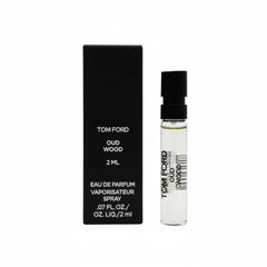 Tom Ford Oud Wood sample vial on hands, ideal for quick fragrance testing on the go