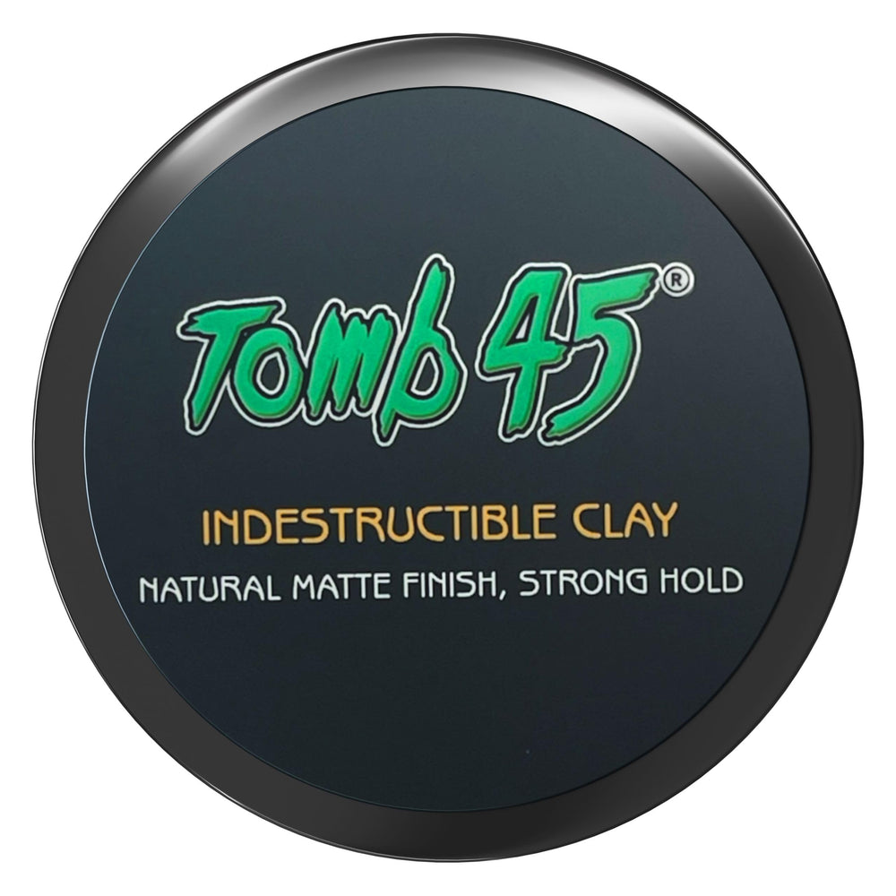 Tomb45 Indestructible Hair Clay bottle closeup for easy styling prep.