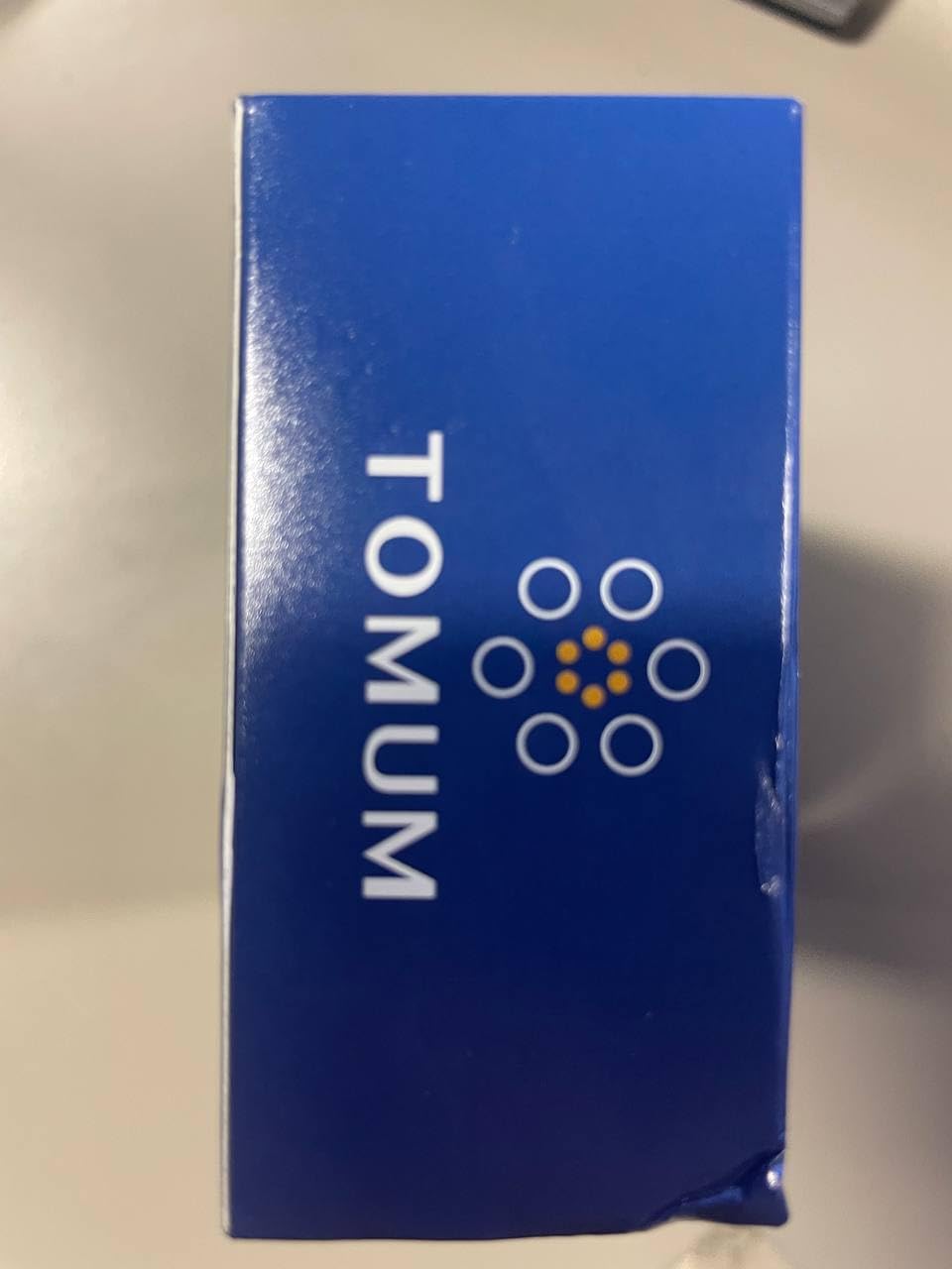 Tomum Minoxidil Foam packaging with compact pump for travel