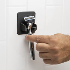 TOOLETRIES Mason Razor Holder on glass surface demonstrates adhesive-free grip for secure storage