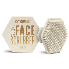 TOOLETRIES Men's Face Scrubber in hand shows silicone bristles for gentle exfoliation.