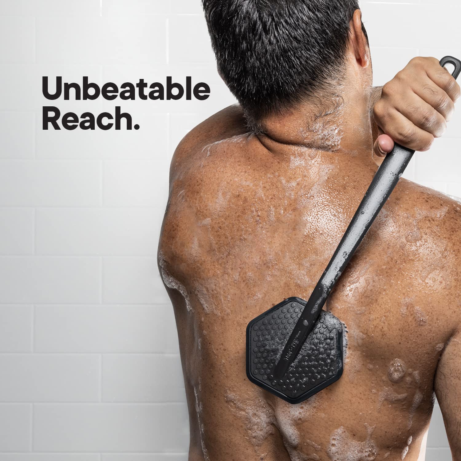 TOOLETRIES back scrubber in the shower for efficient body wash use.