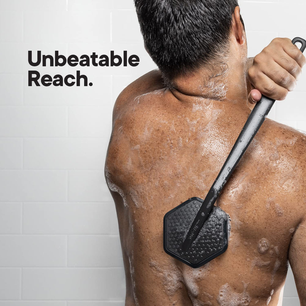 TOOLETRIES back scrubber in the shower for efficient body wash use.