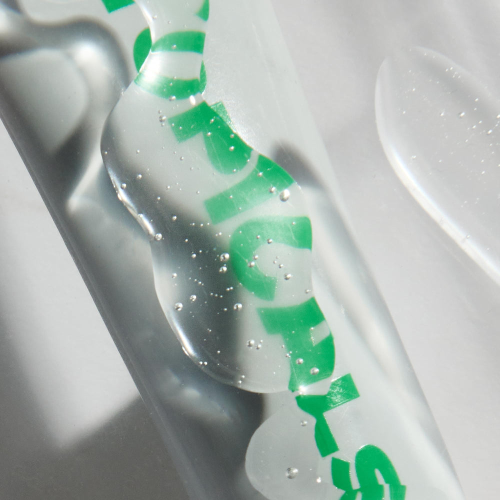 Topicals Slick Salve Mint lip balm on lips in windy conditions for all-day comfort.