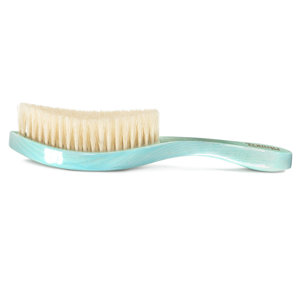Torino Pro Wave Brush blue curved head close-up showing premium materials.