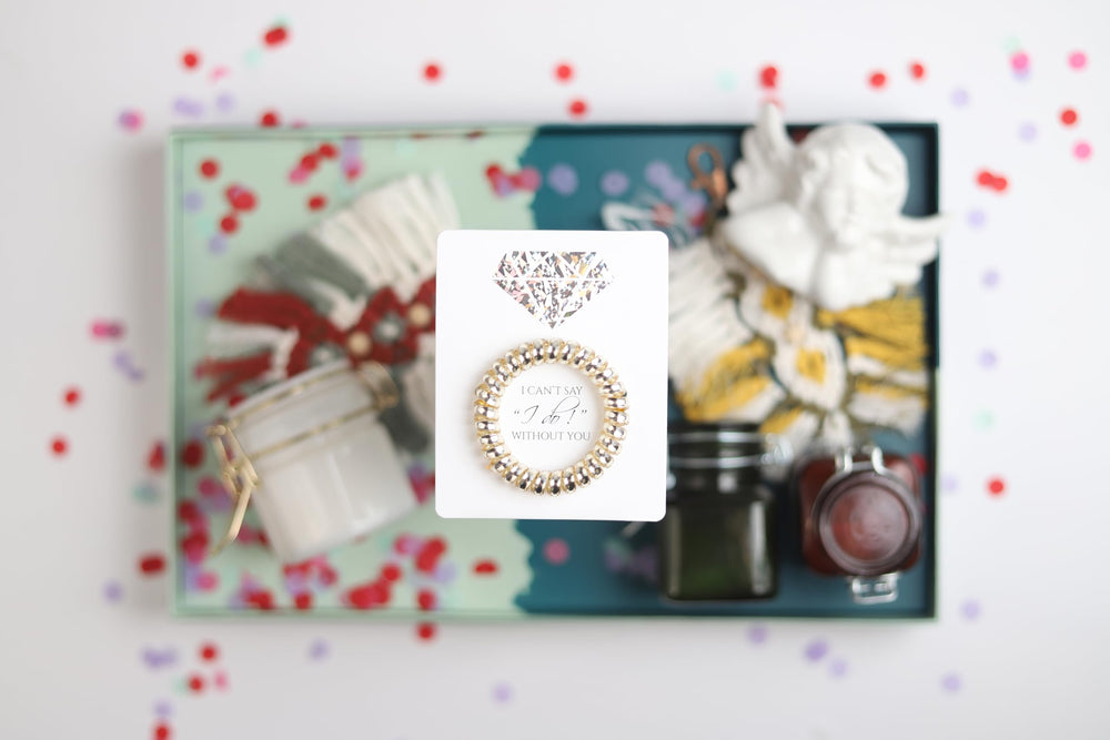 Toros silver spiral hair ties on proposal card ideal maid of honor gift.