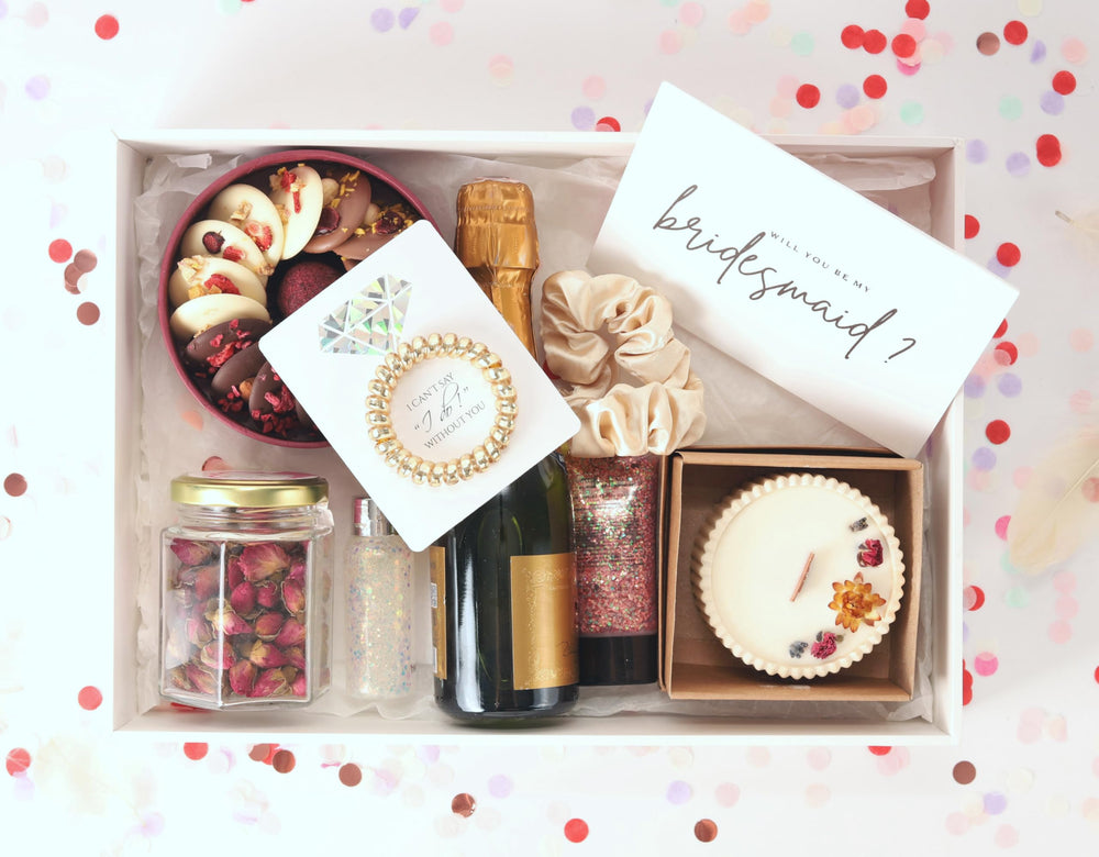 Toros display-ready bridesmaid gifts sparkle with golden spirals and cards.