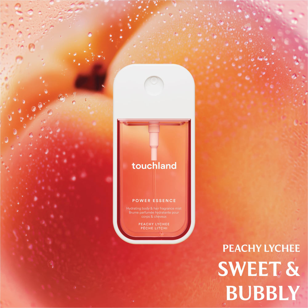 Touchland Fruity Crush mini bottle in hand for quick fragrance touch-ups