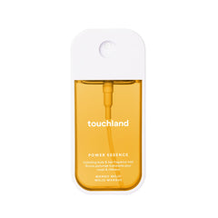 Touchland Mango Mojo fragrance mist bottle highlighting tropical mango notes for an uplifting scent