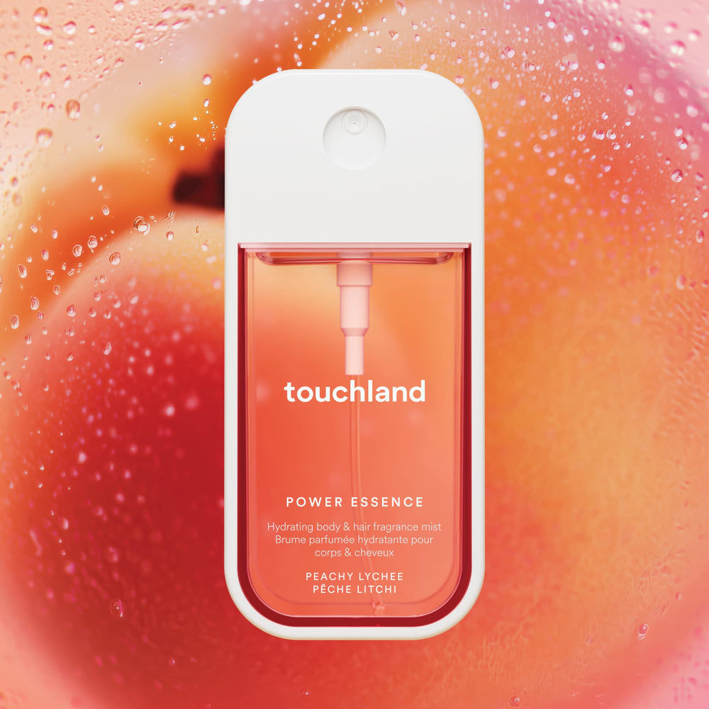 Touchland mist applied to hair and skin during a busy day.