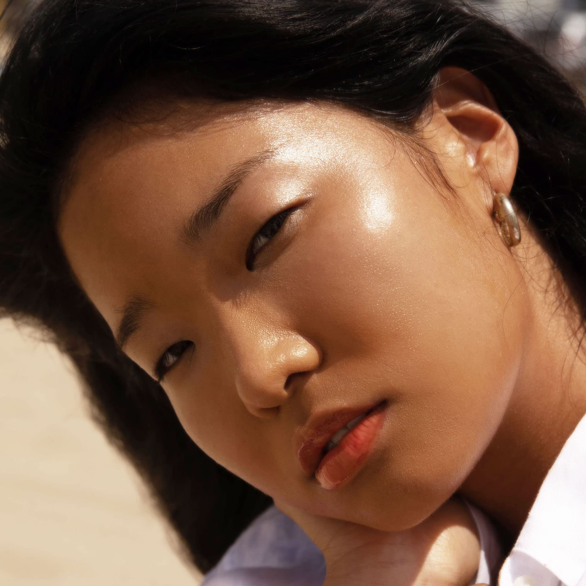 Tower 28 SuperDew Balm on face demonstrates everyday radiant glow.