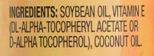 Trader Joe's Vitamin Oil E bottle on countertop for daily use.