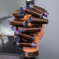 Traininghead mannequin head being washed demonstrates conditioning routine.