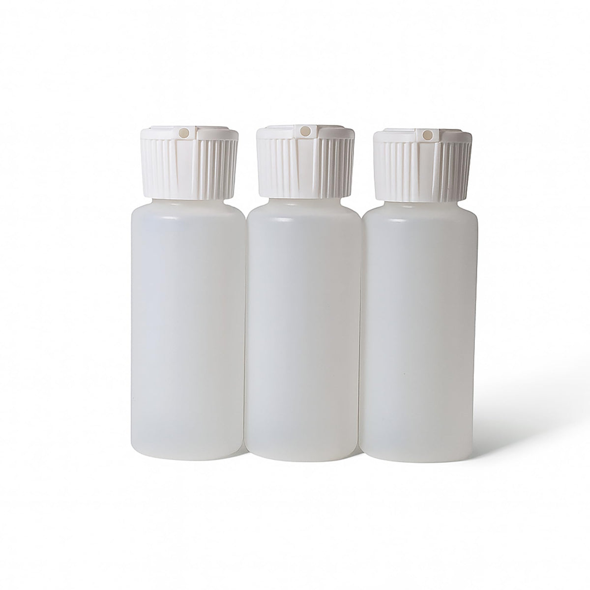 Translucent squeeze bottles with flip-top cap for on-the-go cosmetics.