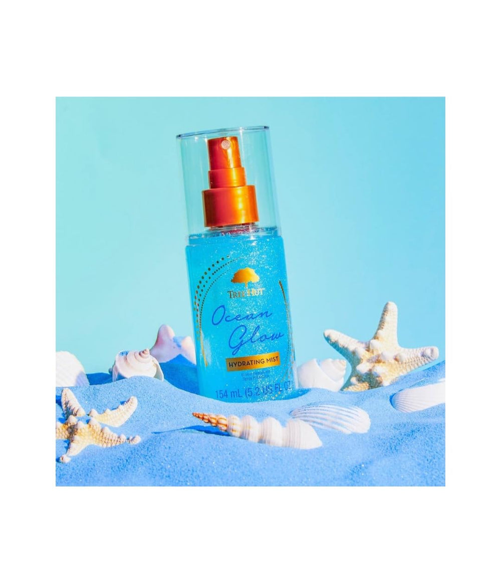 Tree Hut Ocean Glow Fragrance Mist bottle emphasizes long-lasting amber-tropical scent.