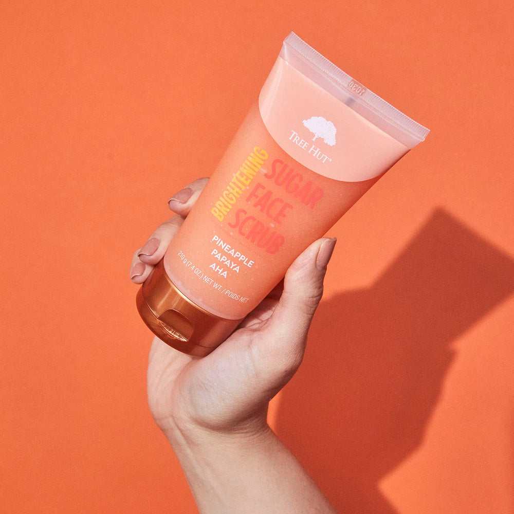 Tree Hut Pineapple & Papaya Face Scrub packaging emphasizes clean formula and fragrance.