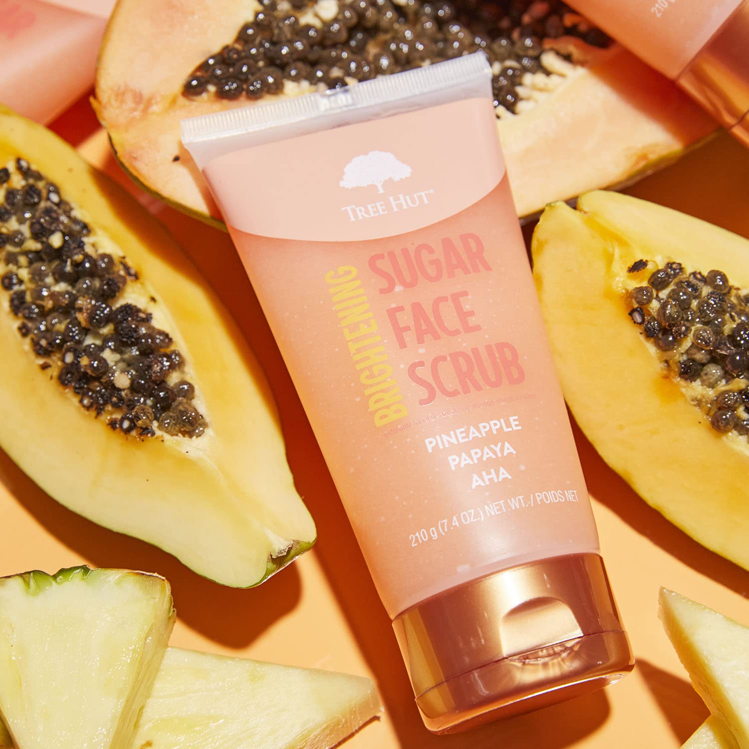 Tree Hut Pineapple & Papaya Face Scrub rinse reveals smooth, renewed skin.
