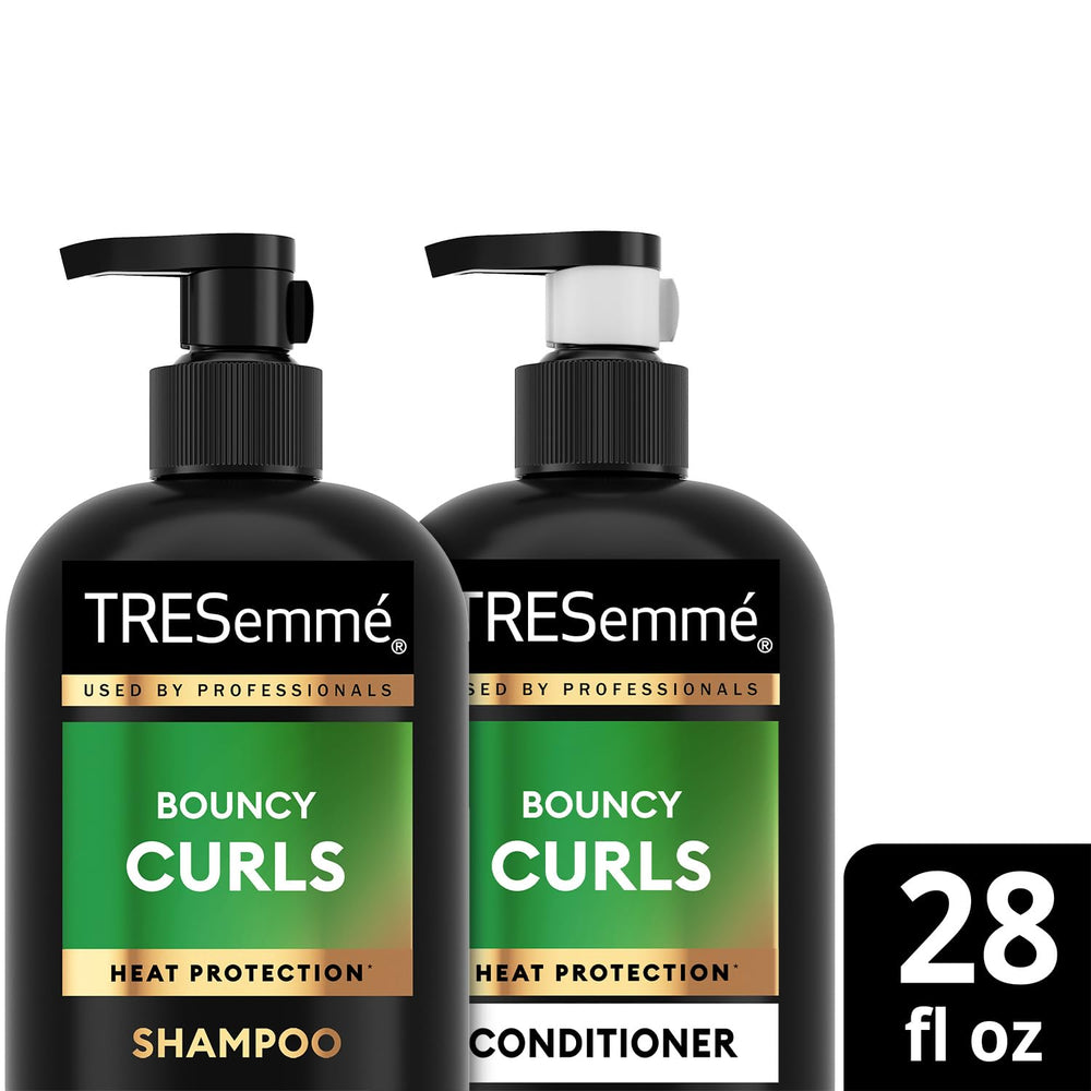 TRESemmé Coconut Essence bottle emphasizes moisture-rich curl care for softness.