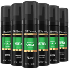 TRESemmé Defining Hair Mousse bottle front showcases defined curls.