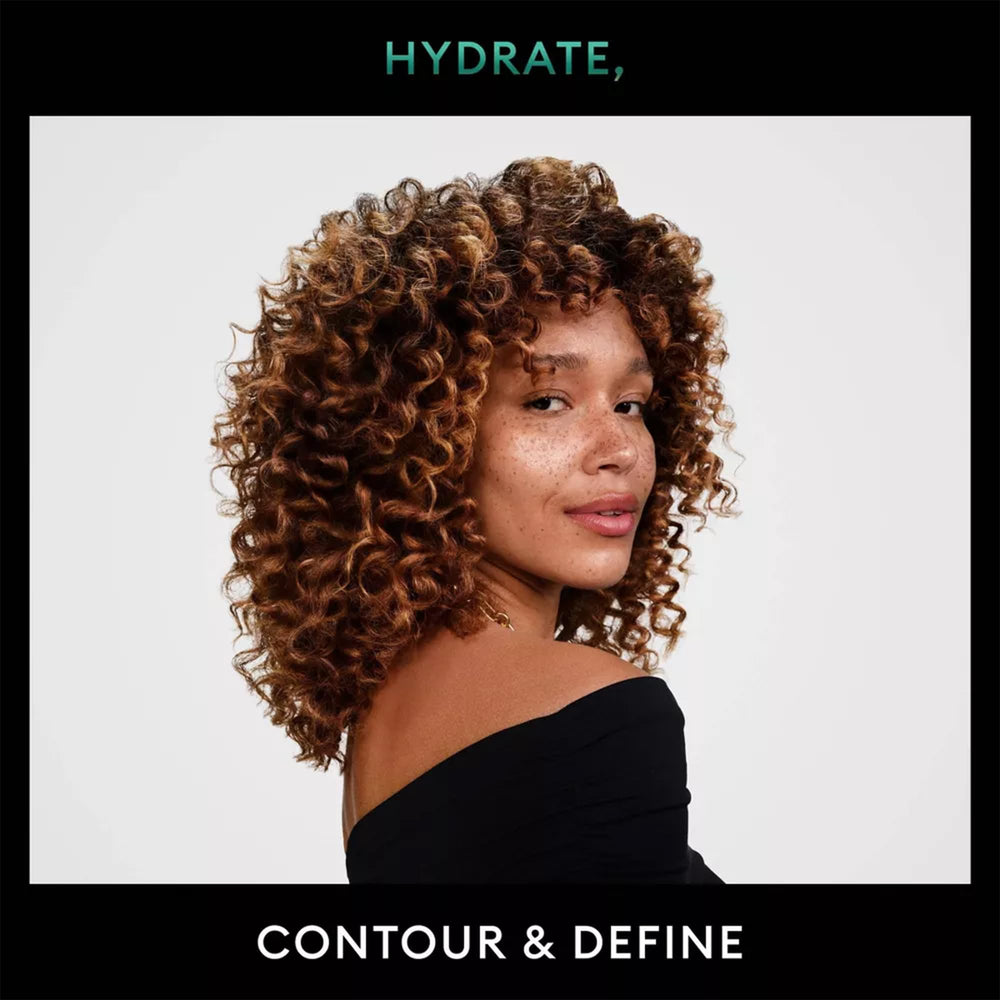 TRESemmé Defining Hair Mousse with coconut oil highlights hydration for curls.