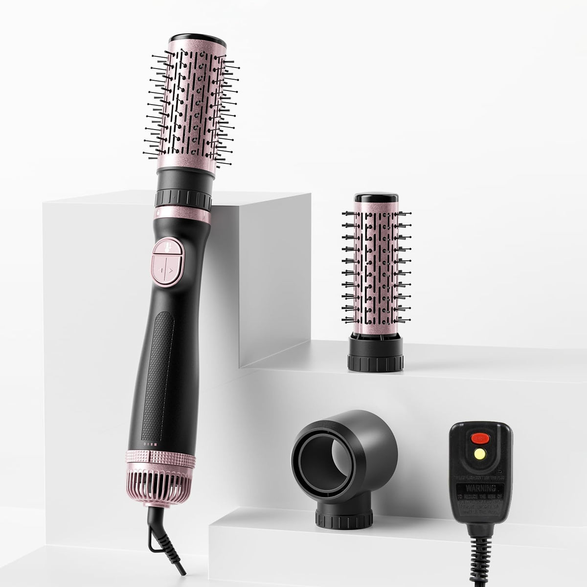 Tresses Touch blow dryer brush main unit in hand for fast, one-step styling.