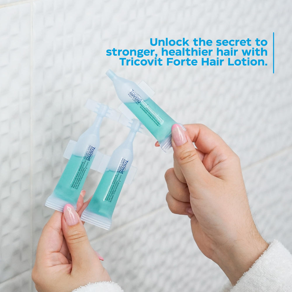 Tricovit Forte scalp application being gently massaged for even distribution.