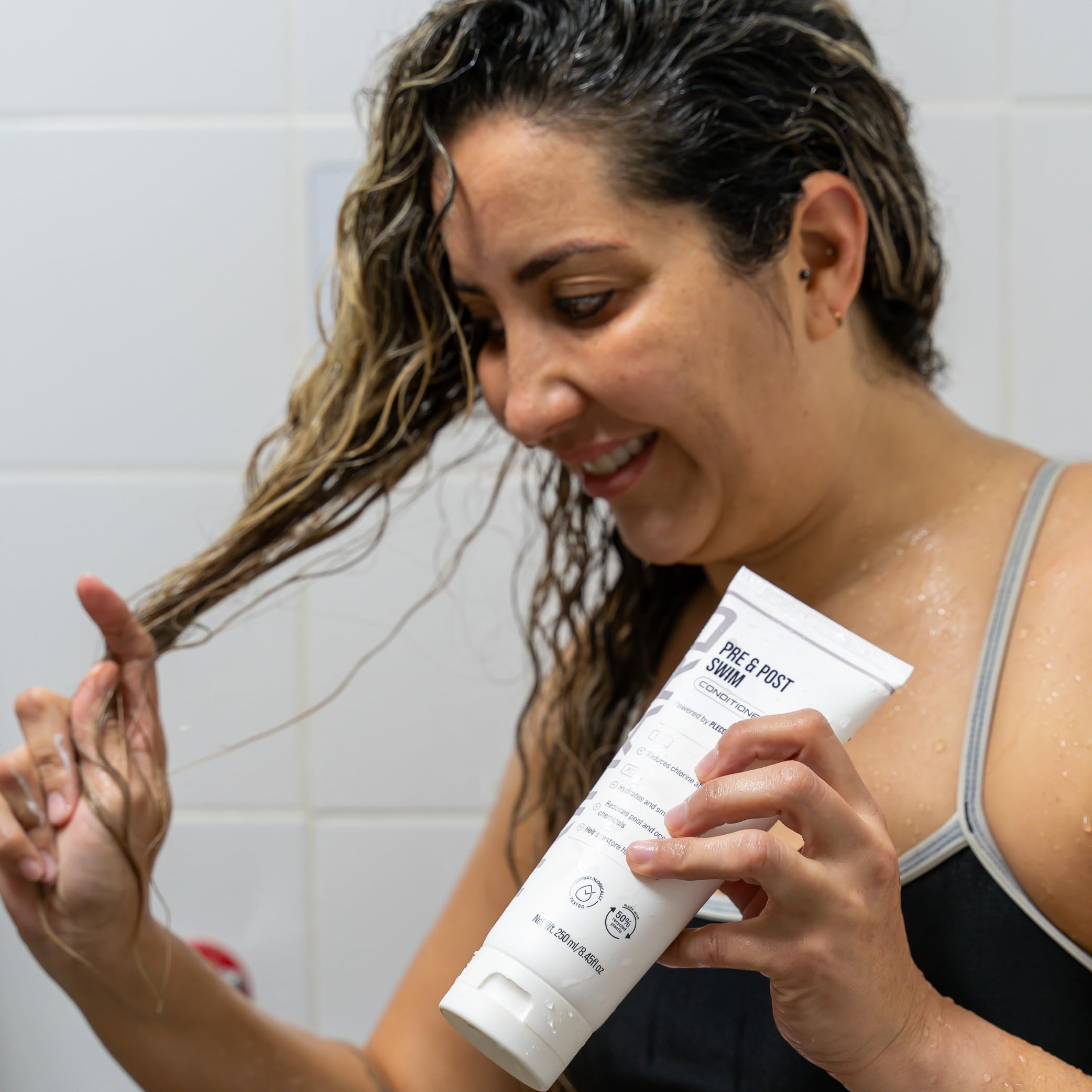 TRIHARD swimmers using conditioner between sets for hair care.