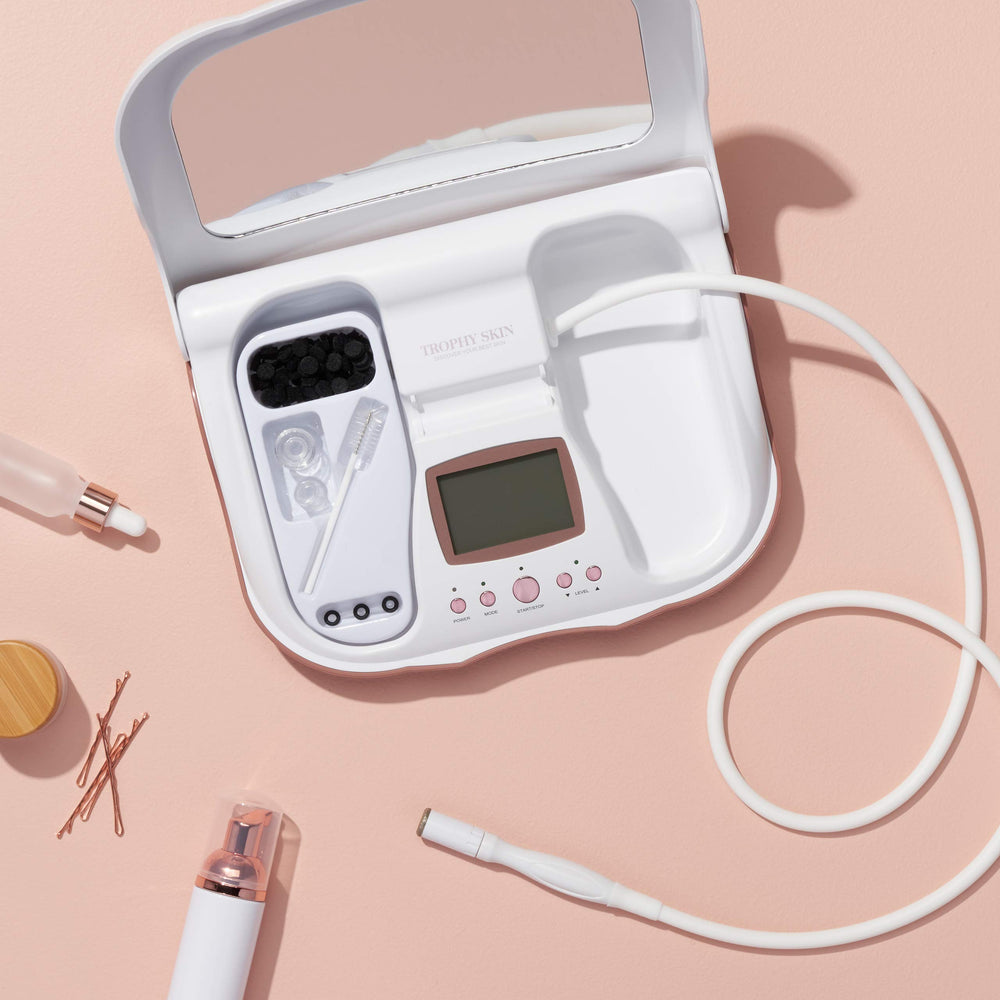 Trophy Skin MicrodermMD at-home kit layout suggesting spa-grade skincare