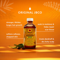 Tropic Isle Living Jamaican Black Castor Oil pour demonstrates easy scalp conditioning.
