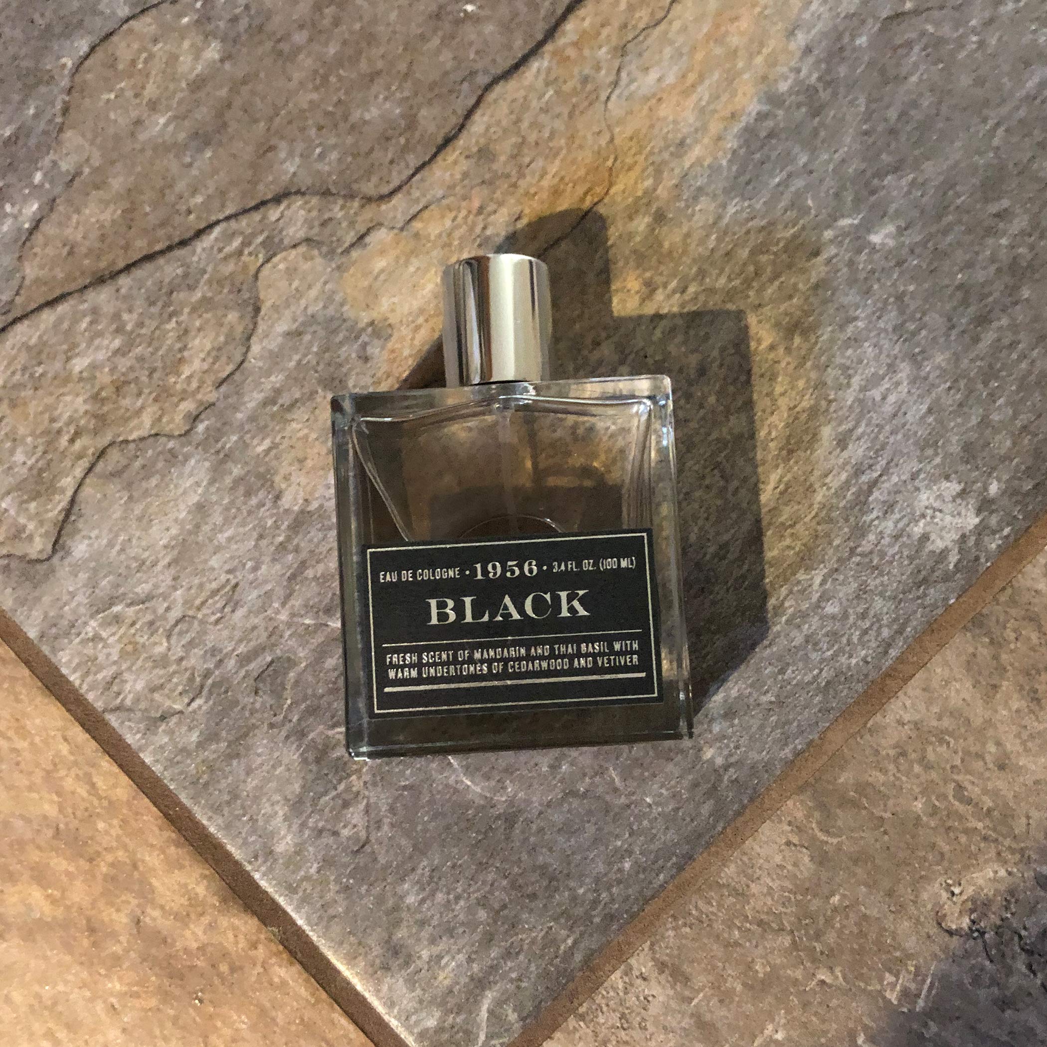 Tru Fragrance Beauty 1956 Black full bottle on shelf suggests gift-ready luxury.