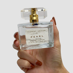 Tru Fragrance Beauty Element Edition Pearl mist on pulse points for relaxed evenings.