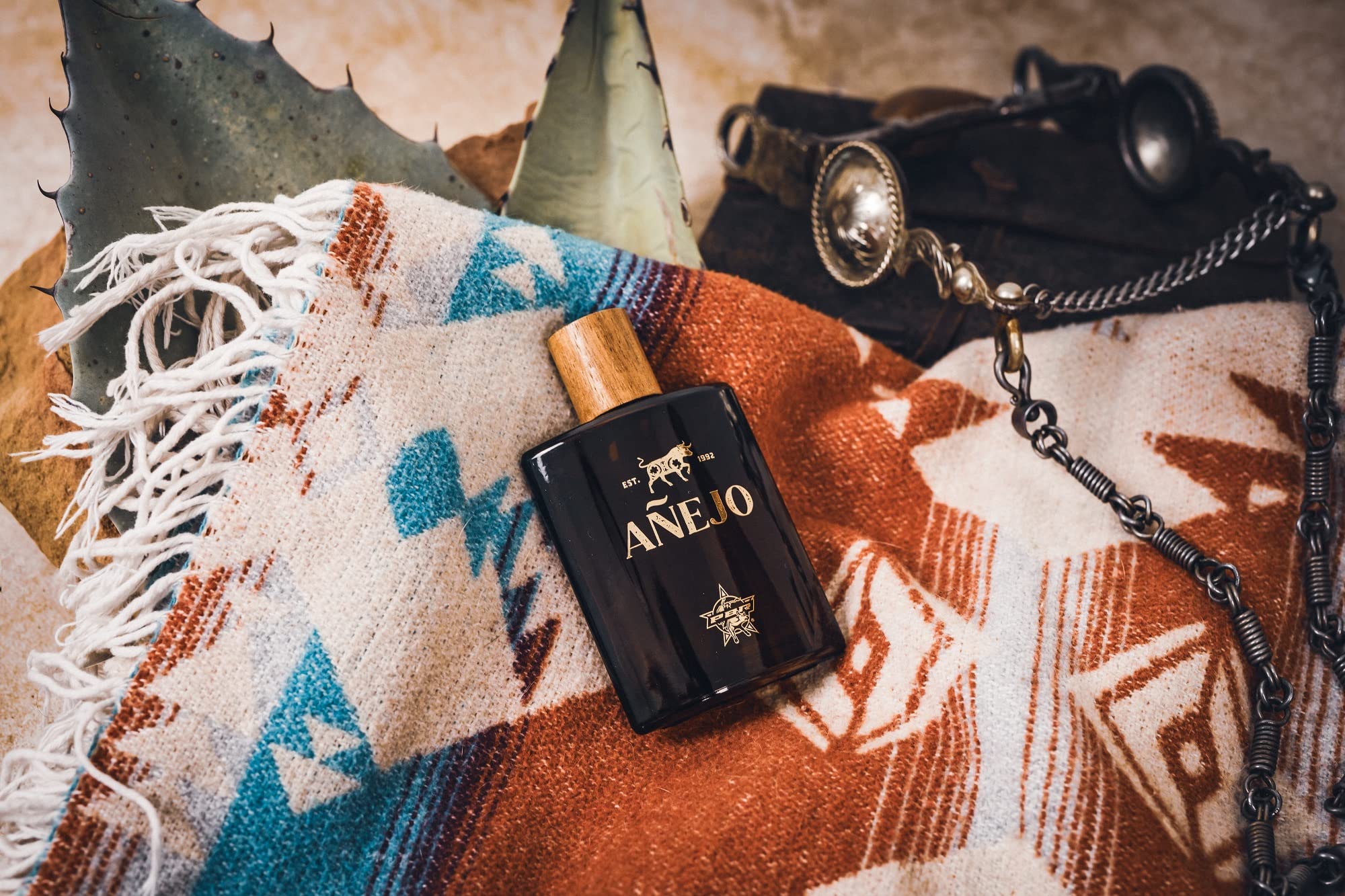 Tru Fragrance Beauty PBR Anejo on wooden surface with warm tone backdrop.