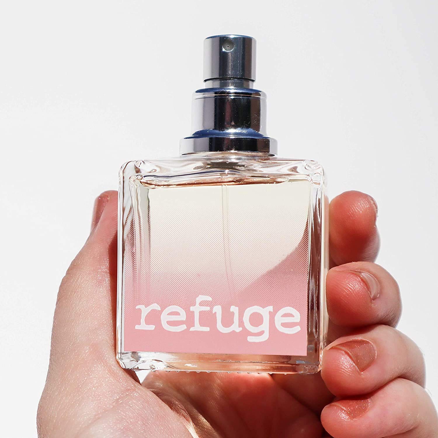 Refuge bottle with foil cap sits on vanity, adding elegant decor.