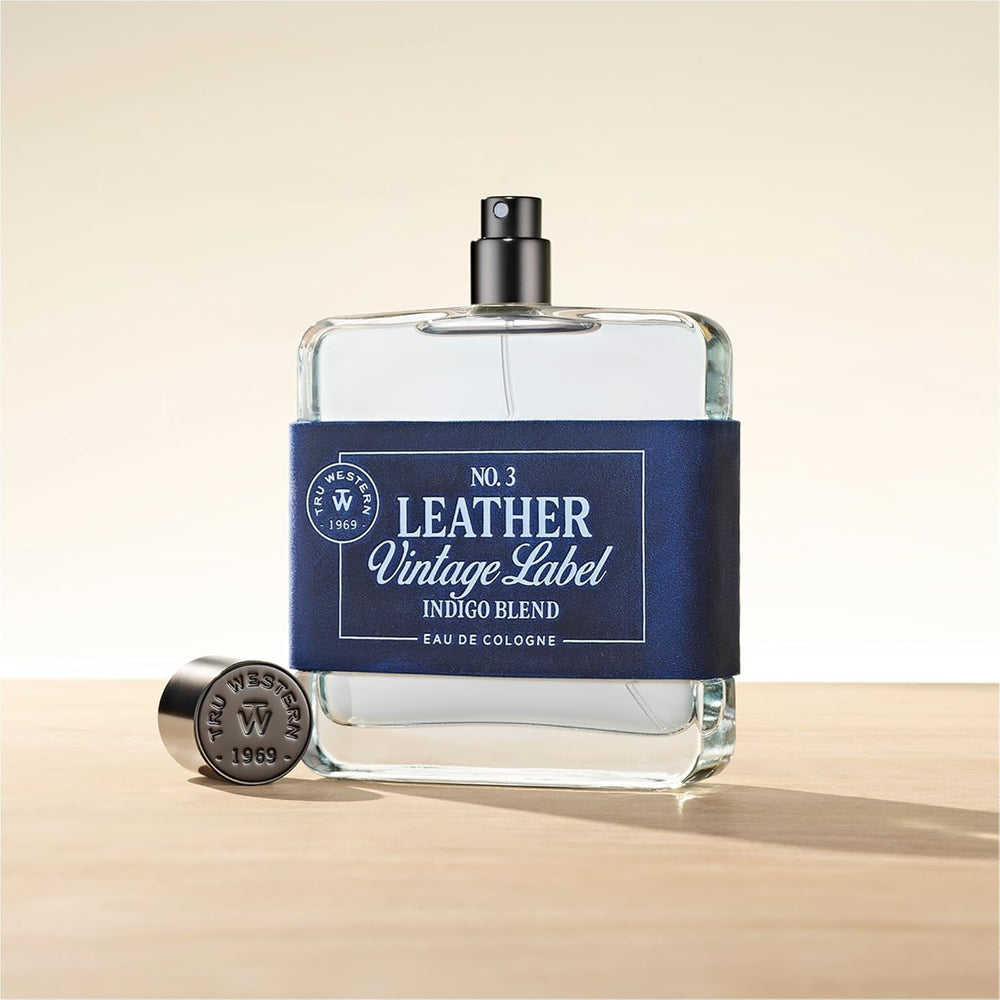 Tru Fragrance Leather No. 3 on wood backdrop hints warmth.