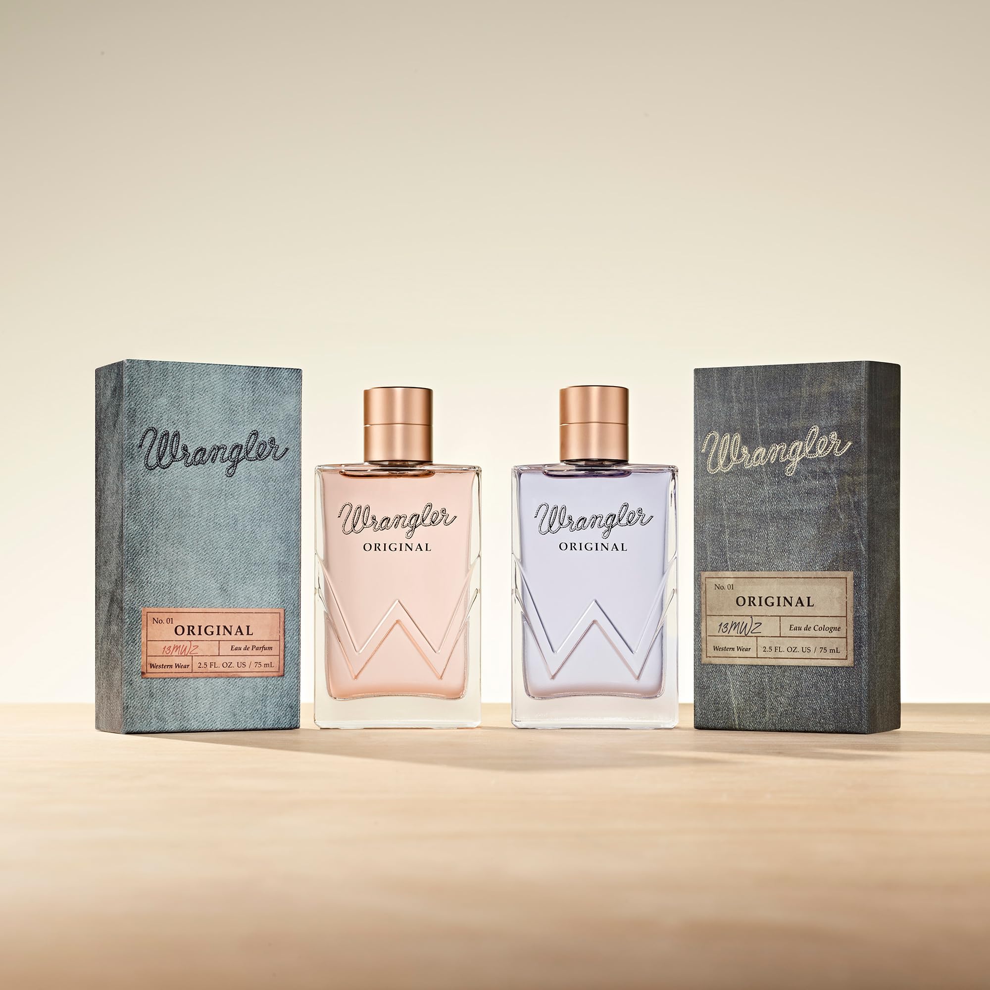 Tru Fragrance Beauty Wrangler Original bottle on wood surface emphasizes rustic-cowgirl aesthetic.