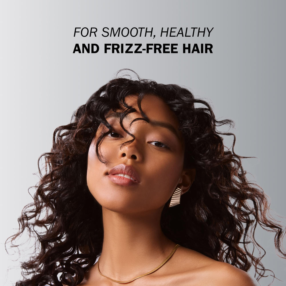 TRUSS Deluxe Prime Deep Conditioner application hands demonstrates easy distribution for even coverage.