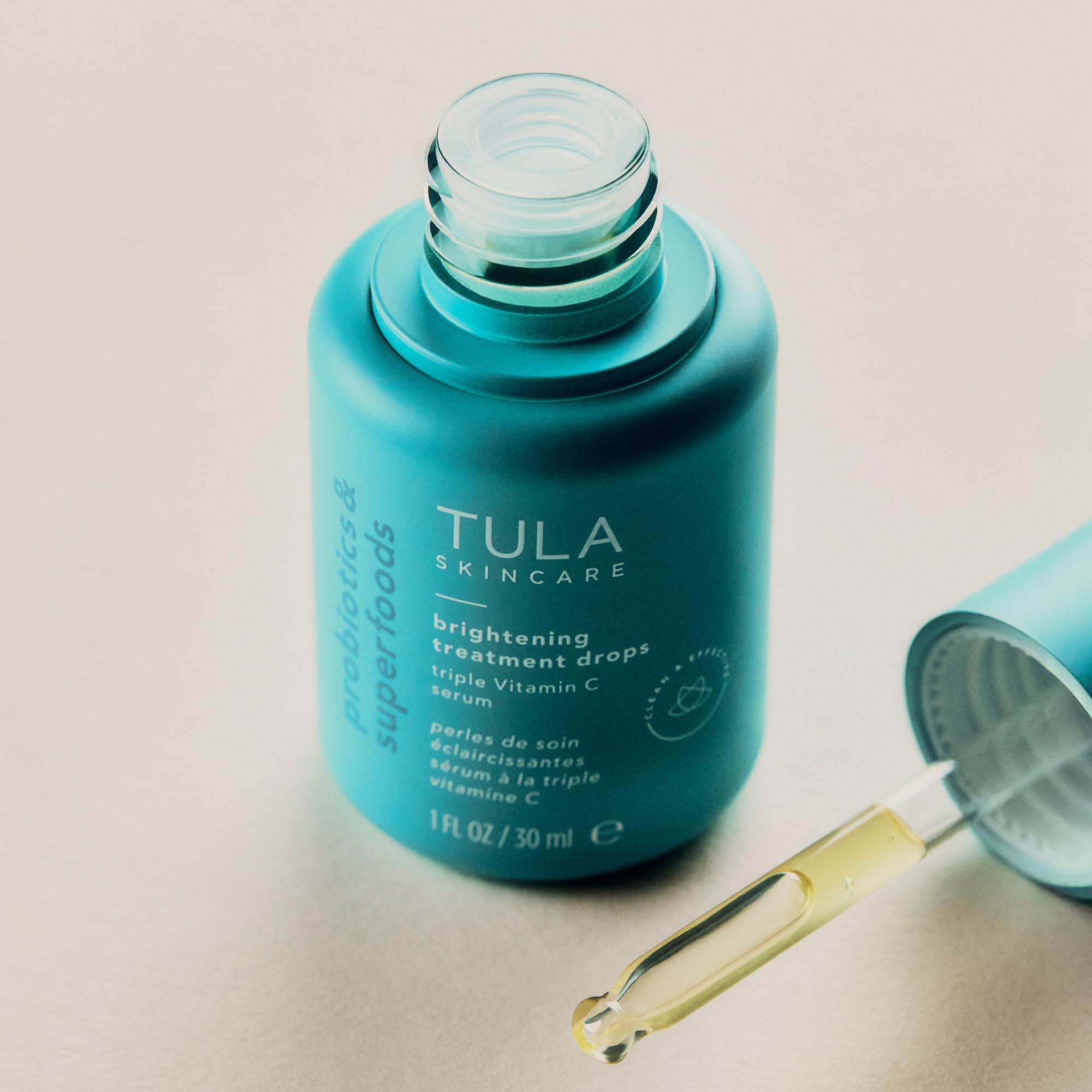 TULA Brightening Treatment Drops being applied on skin suggests easy daily routine.