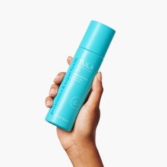 TULA Clarifying Toner pour into cotton pad for evening cleanse and tone